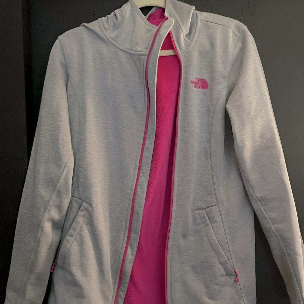 The North Face Jacket, a light gray exterior with hot pink fleece lined interior